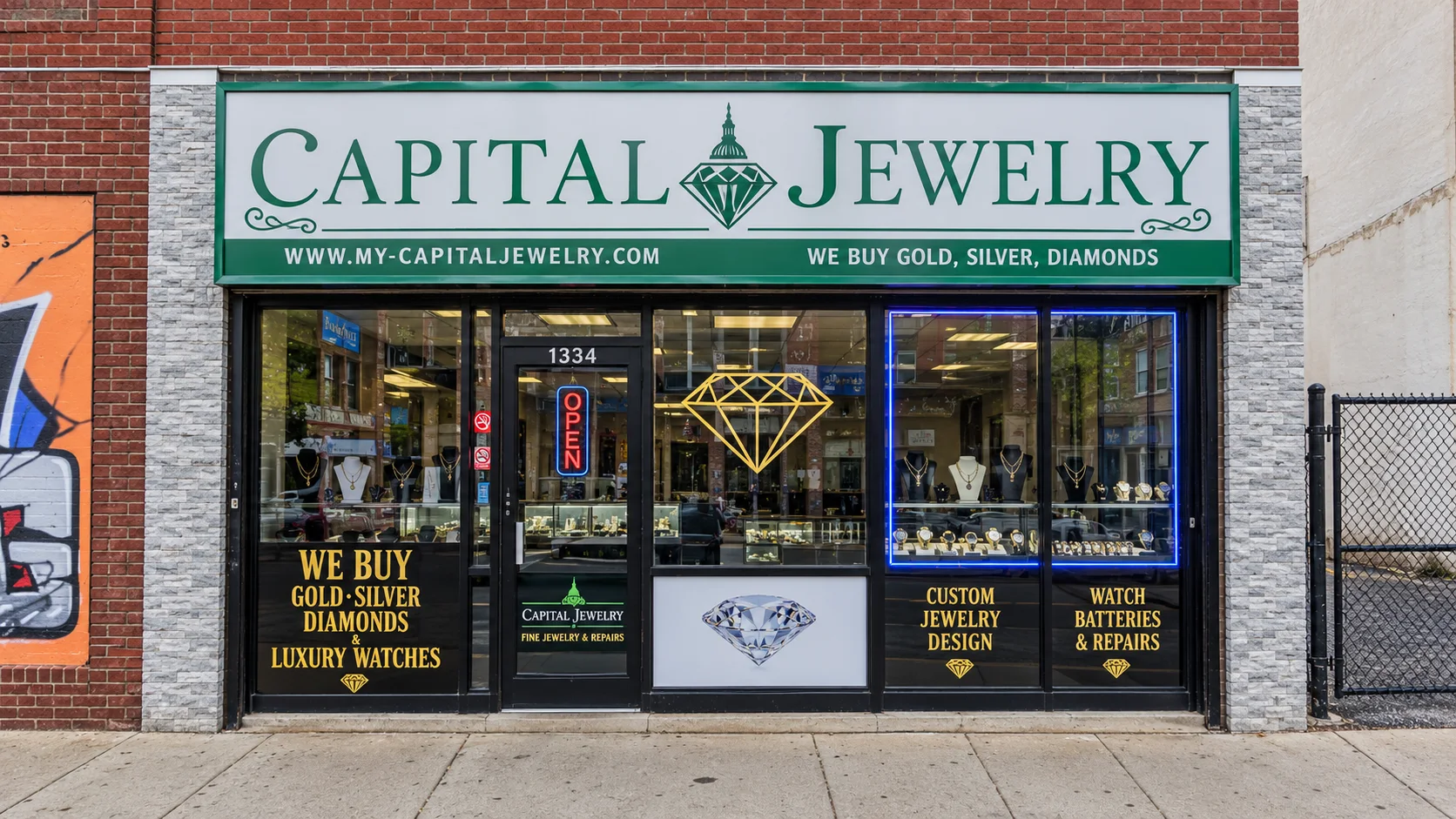 Capital Jewelry storefront in Trenton, NJ, with display windows of gold chains, watches and custom jewelry